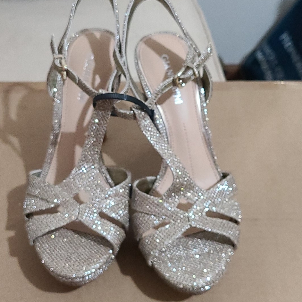 Gold high heel shoes